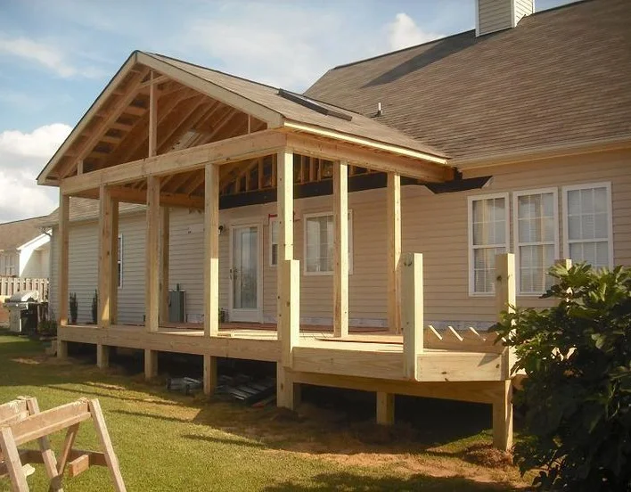 New construction of a covered deck on a home.