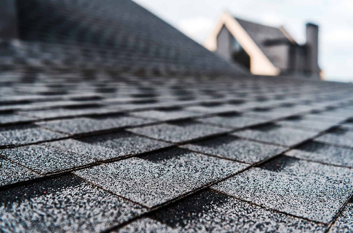 A fresh shingle installation on the roof of a home.